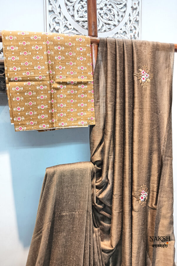 Handloom soft cotton saree with embroidery work in tussar brown color. This handloom soft cotton saree is a perfect blend of style and comfort.
