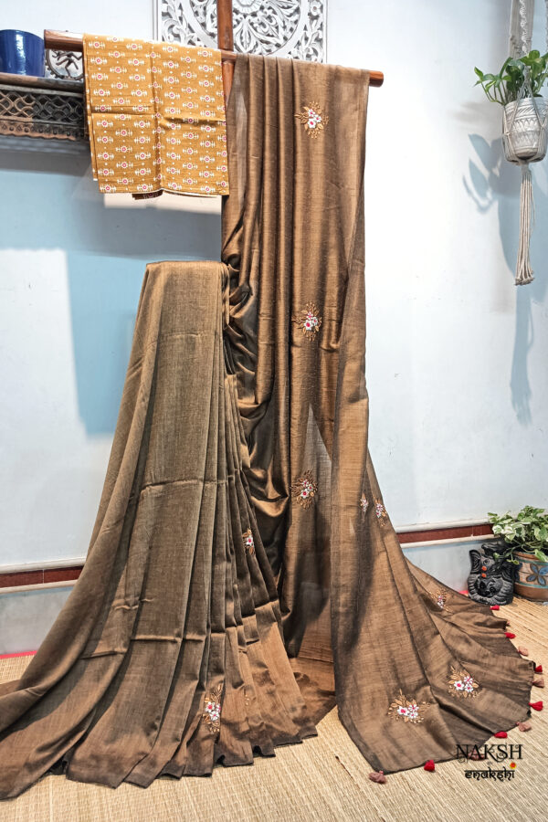 Handloom soft cotton saree with embroidery work in tussar brown color. This handloom soft cotton saree is a perfect blend of style and comfort.