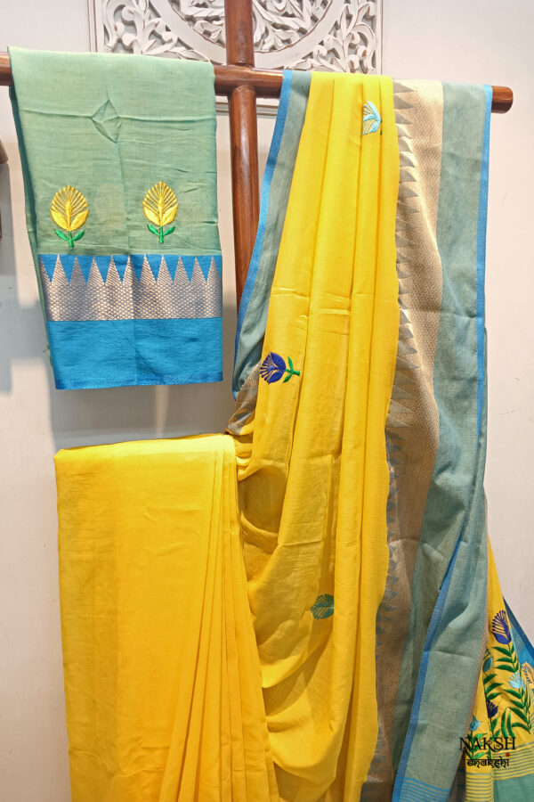 Elevate your ethnic wardrobe with our stunning handloom pure cotton saree in vibrant yellow, adorned with a magnificent firoza-colored temple woven border. This saree is a masterpiece of craftsmanship, featuring intricately embroidered multicolor floral design, neatly and artistically crafted onto the fabric.