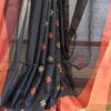 handloom cotton jamdani saree in black color wirh matching blouse piece. this is a very soft cotton saree. beat the heat with this summer friendly cotton jamdani saree, this saree style is perfect for summer in India fashion.