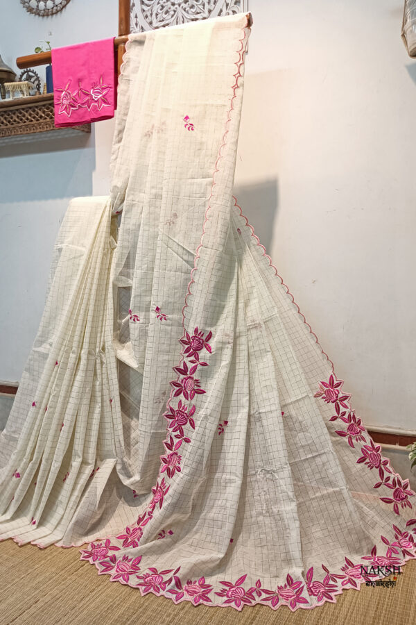 Experience the perfect blend of tradition, style, and comfort with this off white colour handloom pure cotton by cotton saree. Elevate your festive wardrobe with this timeless masterpiece. Crafted from pure handloom cotton, it’s not only lightweight and summer-friendly but also incredibly comfortable to wear all day long. Complete your look with the included embroidered contrast blouse piece. Shop online this beautiful handloom pure cotton saree with exquisite embroidery work.