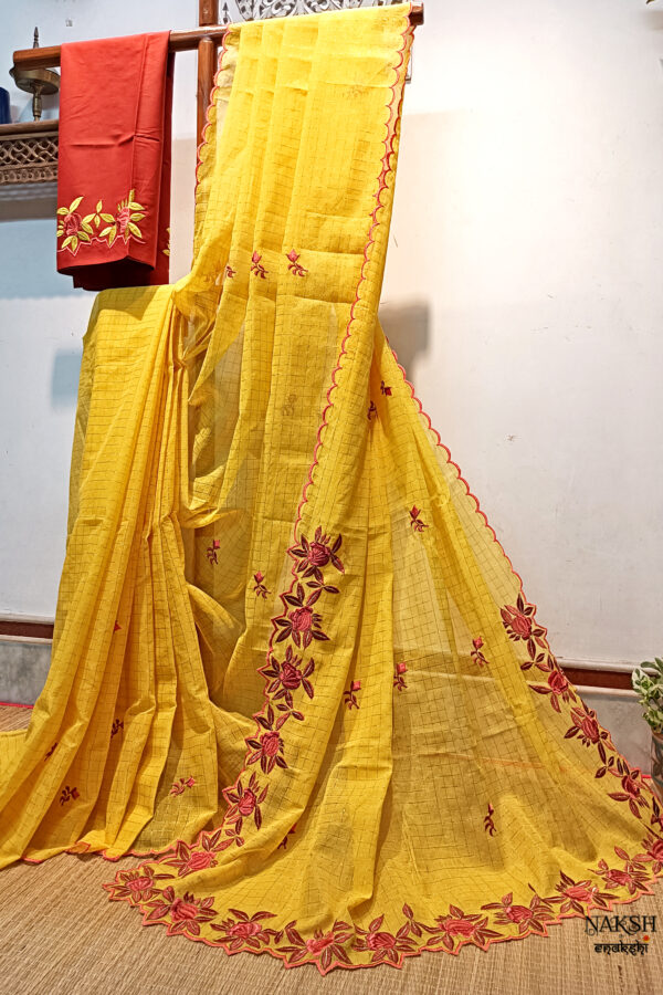 Experience the perfect blend of tradition, style, and comfort with this yellow colour handloom pure cotton by cotton saree. Elevate your festive wardrobe with this timeless masterpiece. Crafted from pure handloom cotton, it’s not only lightweight and summer-friendly but also incredibly comfortable to wear all day long. Complete your look with the included embroidered contrast blouse piece. Shop online this beautiful handloom pure cotton saree with exquisite embroidery work.