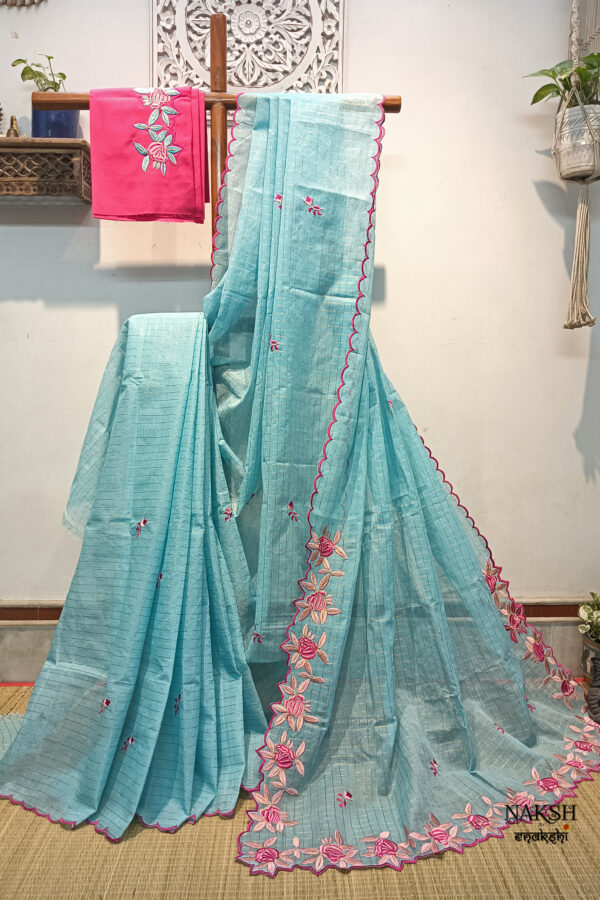 Experience the perfect blend of tradition, style, and comfort with this sky blue colour handloom pure cotton by cotton saree. Elevate your festive wardrobe with this timeless masterpiece. Crafted from pure handloom cotton, it’s not only lightweight and summer-friendly but also incredibly comfortable to wear all day long. Complete your look with the included embroidered contrast blouse piece. Shop online this beautiful handloom pure cotton saree with exquisite embroidery work.