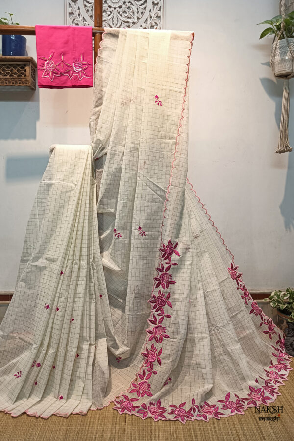 Experience the perfect blend of tradition, style, and comfort with this off white colour handloom pure cotton by cotton saree. Elevate your festive wardrobe with this timeless masterpiece. Crafted from pure handloom cotton, it’s not only lightweight and summer-friendly but also incredibly comfortable to wear all day long. Complete your look with the included embroidered contrast blouse piece. Shop online this beautiful handloom pure cotton saree with exquisite embroidery work.