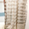 zari stripes white or off white linen saree organic linen saree with blouse piece. Step into elegance with our sophisticated tissue linen sarees, adorned in refreshing pastel shade of mint green that exude timeless charm. Crafted with airy, breathable linen, this saree ensure comfort while making a striking statement with their unique silver zari stripes. Perfect for any occasion, from casual gatherings to formal events, these sarees are versatile and effortlessly stylish. this saree comes with a running blouse piece, completing the ensemble with grace and finesse. Elevate your wardrobe with these exquisite pieces that blend luxury with comfort seamlessly.