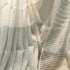 zari stripes white or off white linen saree organic linen saree with blouse piece. Step into elegance with our sophisticated tissue linen sarees, adorned in refreshing pastel shade of mint green that exude timeless charm. Crafted with airy, breathable linen, this saree ensure comfort while making a striking statement with their unique silver zari stripes. Perfect for any occasion, from casual gatherings to formal events, these sarees are versatile and effortlessly stylish. this saree comes with a running blouse piece, completing the ensemble with grace and finesse. Elevate your wardrobe with these exquisite pieces that blend luxury with comfort seamlessly.