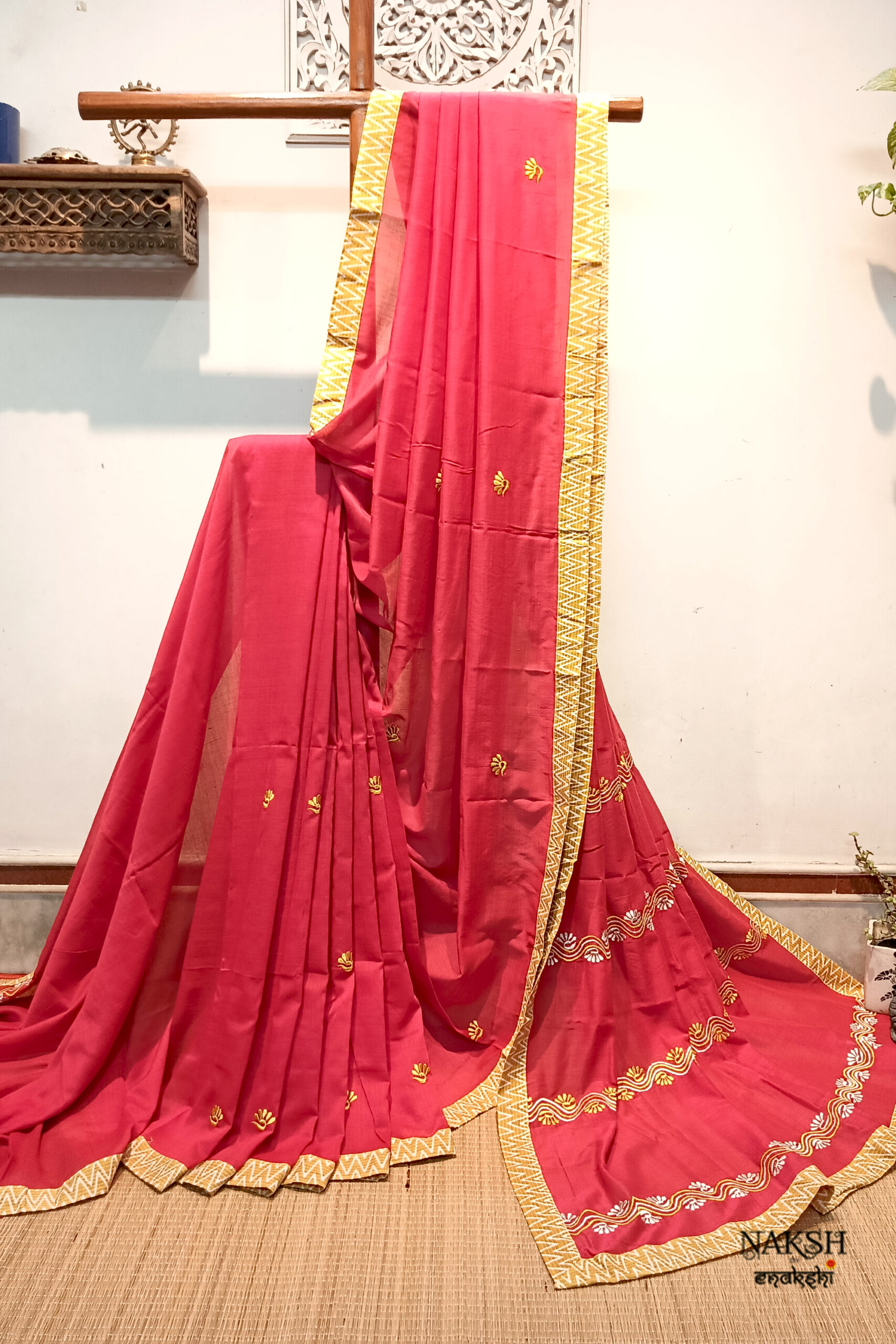 Red embroidered handloom soft cotton saree.This handloom soft cotton saree is a captivating blend of style and comfort. The beautiful floral motif embroidery, neatly done.