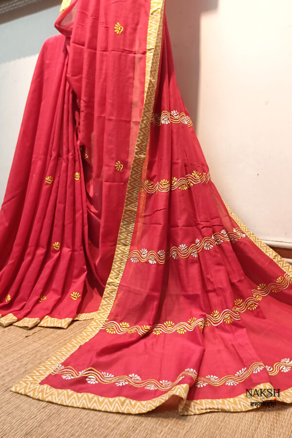 Red embroidered handloom soft cotton saree.This handloom soft cotton saree is a captivating blend of style and comfort. The beautiful floral motif embroidery, neatly done.