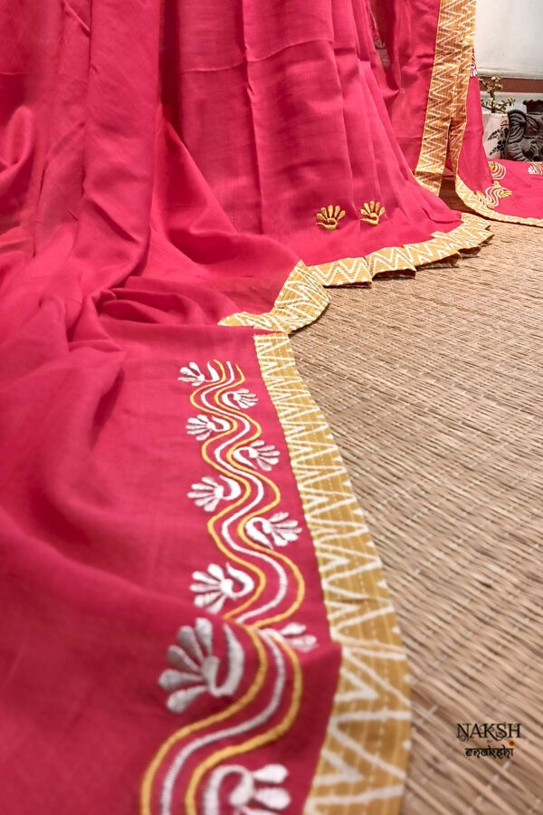 Red embroidered handloom soft cotton saree.This handloom soft cotton saree is a captivating blend of style and comfort. The beautiful floral motif embroidery, neatly done.