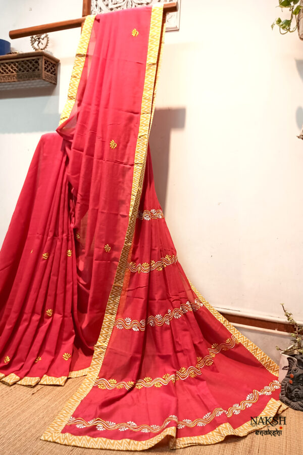 Red embroidered handloom soft cotton saree.This handloom soft cotton saree is a captivating blend of style and comfort. The beautiful floral motif embroidery, neatly done.
