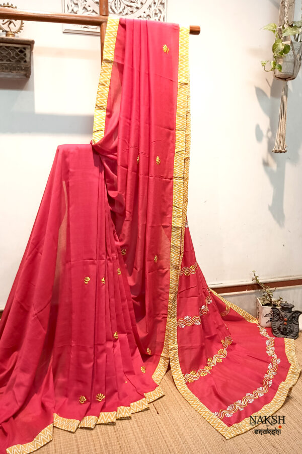 Red embroidered handloom soft cotton saree.This handloom soft cotton saree is a captivating blend of style and comfort. The beautiful floral motif embroidery, neatly done.