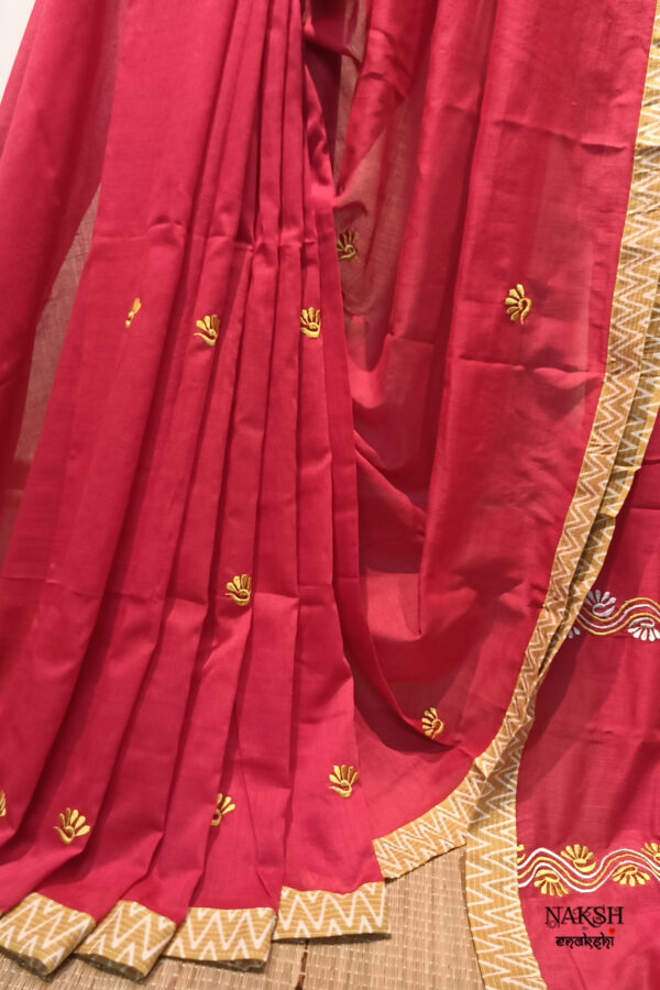 Red embroidered handloom soft cotton saree.This handloom soft cotton saree is a captivating blend of style and comfort. The beautiful floral motif embroidery, neatly done.