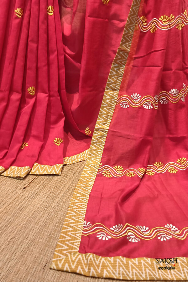 Red embroidered handloom soft cotton saree.This handloom soft cotton saree is a captivating blend of style and comfort. The beautiful floral motif embroidery, neatly done.