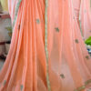 Close up of peach blossom pure cotton handloom saree drape showing teal floral embroidery motifs gold scallop border and white tassels by Naksh by Enakshi