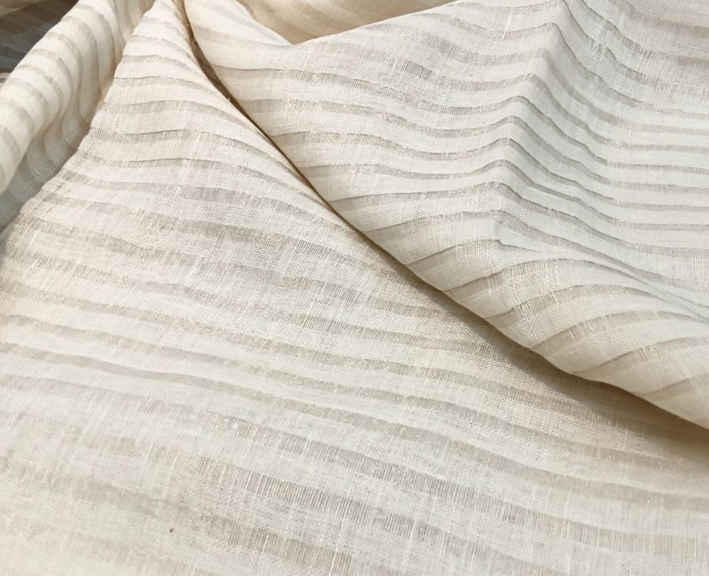 zari stripes white or off white linen saree organic linen saree with blouse piece. Step into elegance with our sophisticated tissue linen sarees, adorned in refreshing pastel shade of mint green that exude timeless charm. Crafted with airy, breathable linen, this saree ensure comfort while making a striking statement with their unique silver zari stripes. Perfect for any occasion, from casual gatherings to formal events, these sarees are versatile and effortlessly stylish. this saree comes with a running blouse piece, completing the ensemble with grace and finesse. Elevate your wardrobe with these exquisite pieces that blend luxury with comfort seamlessly.