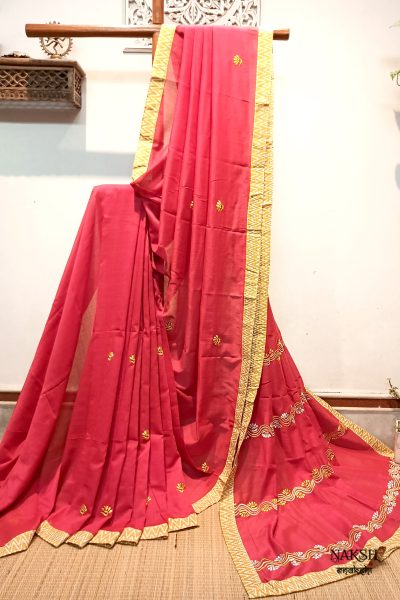 Red embroidered handloom soft cotton saree.This handloom soft cotton saree is a captivating blend of style and comfort. The beautiful floral motif embroidery, neatly done.